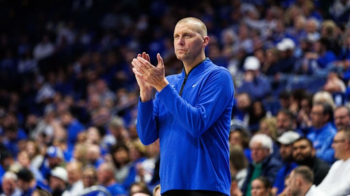 Oct 30, 2025; Lexington, KY, USA; Kentucky Wildcats head coach Mark Pope claps as he watches the action during the first half against the Georgetown Hoyas at Rupp Arena at Central Bank Center. Mandatory Credit: Jordan Prather-Imagn Images