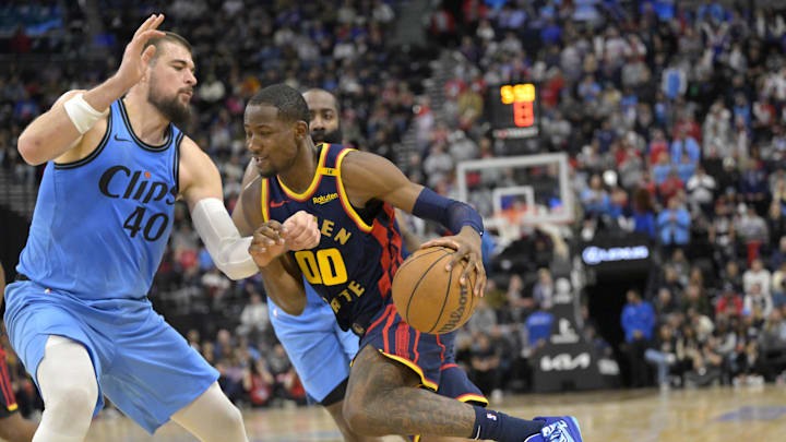 Dec 27, 2024; Inglewood, California, USA; Los Angeles Clippers center Ivica Zubac (40) defends Golden State Warriors forward Jonathan Kuminga (00) in the second half at Intuit Dome. Mandatory Credit: Jayne Kamin-Oncea-Imagn Images