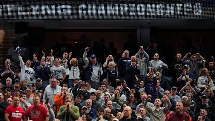 Penn State wrestling fans cheer during the NCAA Wrestling Championships at Rocket Arena. Penn State wrestling fans cheer during the NCAA Wrestling Championships at Rocket Arena.