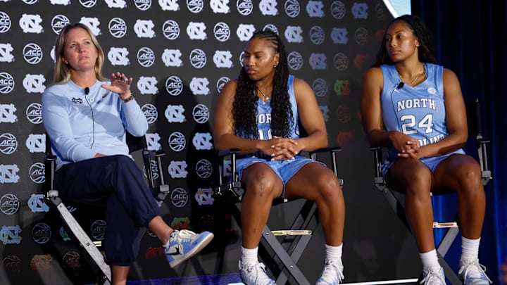 North Carolina head coacgh Courtney Banghart with players Reniya Kelly and Indya Nivar at the ACC Tipoff on Monday, Oct. 6, 2025.