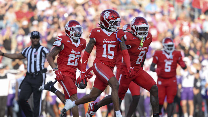 Nov 22, 2025; Houston, Texas, USA; Houston Cougars defensive back Will James (15) celebrates after an interception during the second quarter against the TCU Horned Frogs at TDECU Stadium. Mandatory Credit: Troy Taormina-Imagn Images