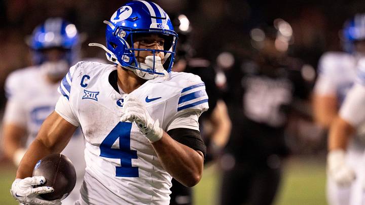 BYU Cougars running back LJ Martin (4) scores a touchdown in the fourth quarter of the NCAA football game between the Cincinnati Bearcats and BYU Cougars at Nippert Stadium in Cincinnati on Nov. 22, 2025.