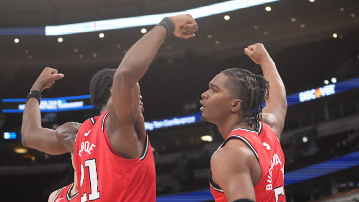 Mar 11, 2026; Chicago, IL, USA; Rutgers Scarlet Knights guard Darren Buchanan Jr. (5) celebrates his basket with Rutgers Scarlet Knights center Emmanuel Ogbole (21) against the Minnesota Golden Gophers during the second half at United Center. Mandatory Credit: David Banks-Imagn Images
