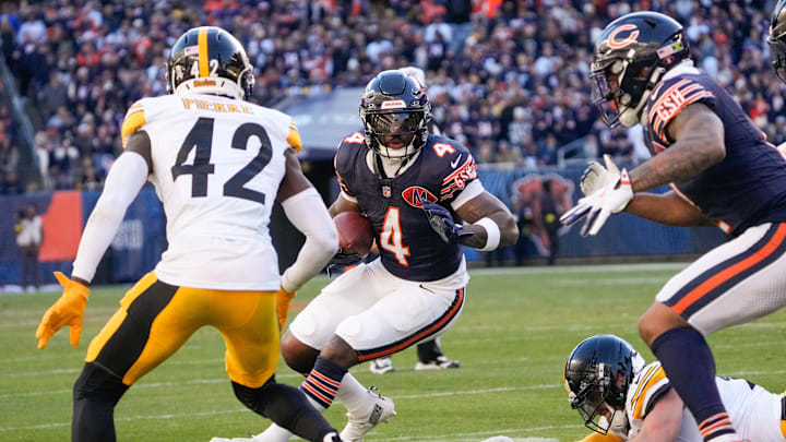 Nov 23, 2025; Chicago, Illinois, USA; Chicago Bears running back D'Andre Swift (4) carries the ball as Pittsburgh Steelers cornerback James Pierre (42) defends during the second half at Soldier Field. Mandatory Credit: David Banks-Imagn Images Nov 23, 2025; Chicago, Illinois, USA; Chicago Bears running back D'Andre Swift (4) carries the ball as Pittsburgh Steelers cornerback James Pierre (42) defends during the second half at Soldier Field. Mandatory Credit: David Banks-Imagn Images