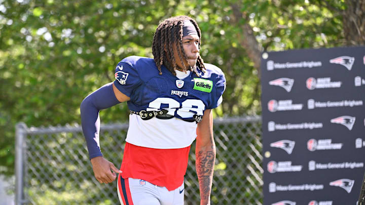 Jul 28, 2025; Foxborough, MA, USA; New England Patriots cornerback Alex Austin (28) heads to the practice fields for training camp at Gillette Stadium. Mandatory Credit: Eric Canha-Imagn Images
