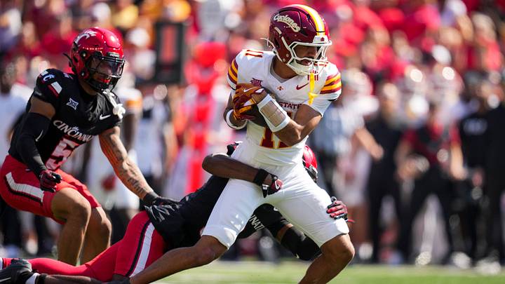 Oct 4, 2025; Cincinnati, Ohio, USA; Iowa State Cyclones wide receiver Dominic Overby (11) makes a catch against Cincinnati Bearcats cornerback Matthew McDoom (0) in the first half at Nippert Stadium. Mandatory Credit: Aaron Doster-Imagn Images Oct 4, 2025; Cincinnati, Ohio, USA; Iowa State Cyclones wide receiver Dominic Overby (11) makes a catch against Cincinnati Bearcats cornerback Matthew McDoom (0) in the first half at Nippert Stadium. Mandatory Credit: Aaron Doster-Imagn Images