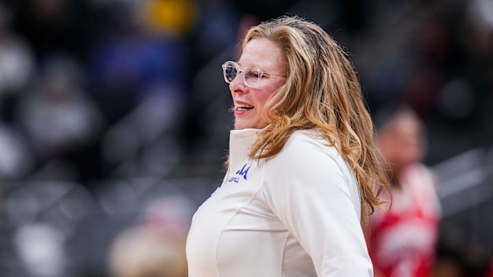 UCLA Bruins head coach Cori Close smiles while frustrated with a call Saturday, March 8, 2025, in a semifinals game at the 2025 TIAA Big Ten Women's Basketball Tournament between the UCLA Bruins and the Ohio State Buckeyes at Gainbridge Fieldhouse in Indianapolis. UCLA Bruins head coach Cori Close smiles while frustrated with a call Saturday, March 8, 2025, in a semifinals game at the 2025 TIAA Big Ten Women's Basketball Tournament between the UCLA Bruins and the Ohio State Buckeyes at Gainbridge Fieldhouse in Indianapolis.