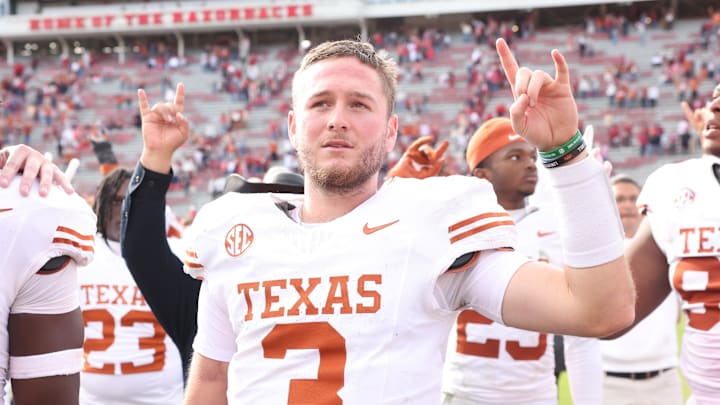 Nov 16, 2024; Fayetteville, Arkansas, USA; Texas Longhorns quarterback Quinn Ewers (3) celebrates after the game against the Arkansas Razorbacks at Donald W. Reynolds Razorback Stadium. Texas won 20-10. Mandatory Credit: Nelson Chenault-Imagn Images