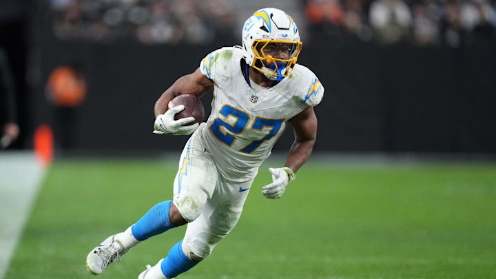 Jan 5, 2025; Paradise, Nevada, USA; Los Angeles Chargers running back J.K. Dobbins (27) carries the ball against the Las Vegas Raiders in the second half at Allegiant Stadium. Mandatory Credit: Kirby Lee-Imagn Images