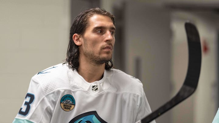 Apr 1, 2024; San Jose, California, USA;  Seattle Kraken left wing Brandon Tanev (13) prepare for warmups before the start of the first period against the San Jose Sharks at SAP Center at San Jose. Mandatory Credit: Stan Szeto-Imagn Images