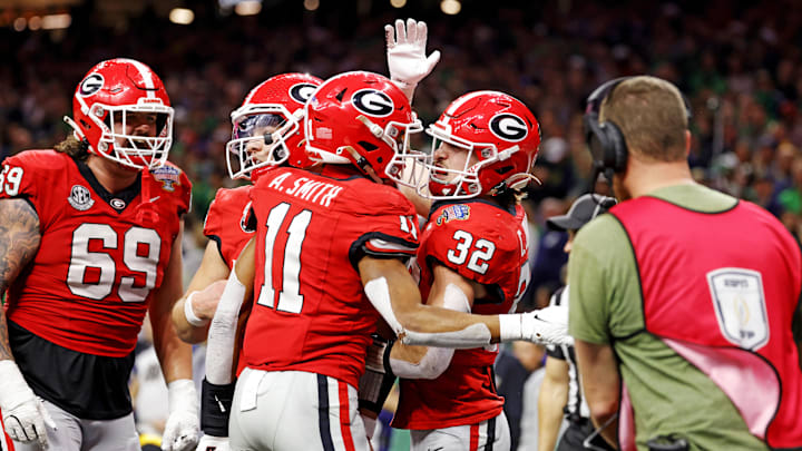 Jan 2, 2025; New Orleans, LA, USA; Georgia Bulldogs running back Cash Jones (32) celebrates after scoring a touchdown during the second half against the Notre Dame Fighting Irish at Caesars Superdome. Mandatory Credit: Amber Searls-Imagn Images
