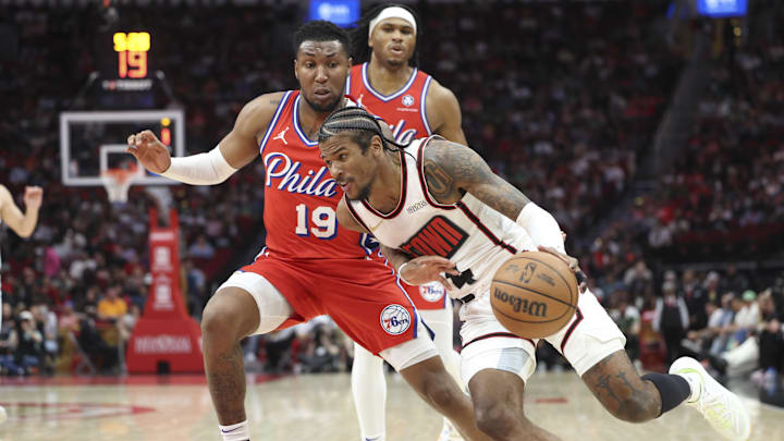 Mar 17, 2025; Houston, Texas, USA; Houston Rockets guard Jalen Green (4) drives with the ball as Philadelphia 76ers forward Justin Edwards (19) defends during the second quarter at Toyota Center. Mandatory Credit: Troy Taormina-Imagn Images