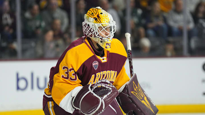 Oct 3, 2025; Tempe, AZ, USA; Arizona State Sun Devils goalie Connor Hasley (33) looks on against the Penn State Nittany Lions during the first period at Mullett Arena. 