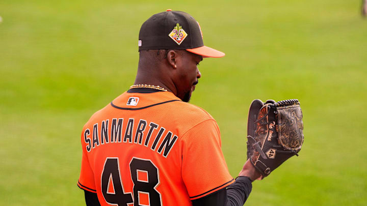 Feb 16, 2026; Scottsdale, AZ, USA; San Francisco Giants pitcher Reiver Sanmartin looks at his glove during workouts at Scottsdale Stadium in Scottsdale, Arizona.  Mandatory Credit: Arianna Grainey-Imagn Images