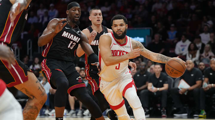 Mar 21, 2025; Miami, Florida, USA; Houston Rockets guard Fred VanVleet (5) drives past Miami Heat center Bam Adebayo (13) in the first half at Kaseya Center. Mandatory Credit: Jim Rassol-Imagn Images Mar 21, 2025; Miami, Florida, USA; Houston Rockets guard Fred VanVleet (5) drives past Miami Heat center Bam Adebayo (13) in the first half at Kaseya Center. Mandatory Credit: Jim Rassol-Imagn Images