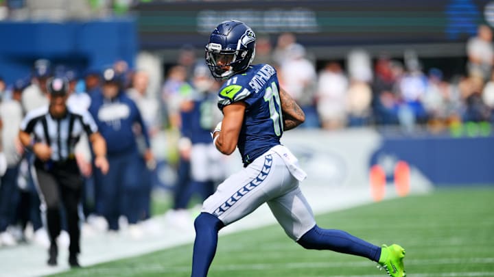 Sep 7, 2025; Seattle, Washington, USA; Seattle Seahawks wide receiver Jaxon Smith-Njigba (11) runs the ball during the first half against San Francisco 49ers at Lumen Field. Mandatory Credit: Steven Bisig-Imagn Images