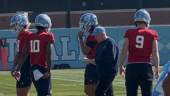 Bobby Petrino, center, is in his first season as the offensive coordinator for UNC football, entering the Tar Heels' second year under head coach Bill Belichick.