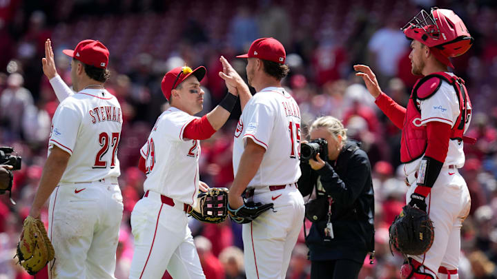 The Reds celebrate a win after the ninth inning of the MLB National League game between the Cincinnati Reds and the Colorado Rockies at Great American Ball Park in downtown Cincinnati on Thursday, April 30, 2026. The Reds won 6-4.