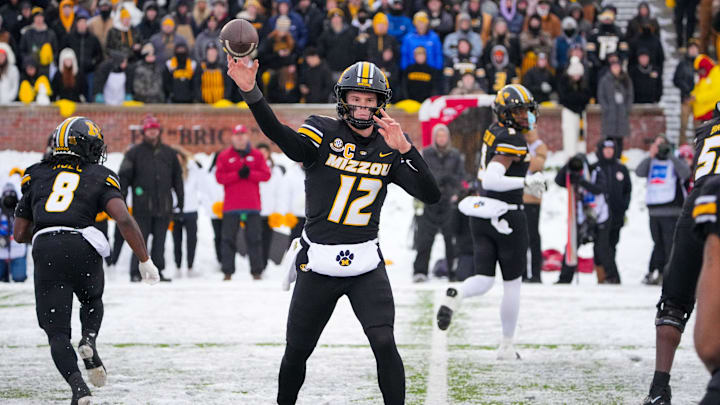 Nov 30, 2024; Columbia, Missouri, USA; Missouri Tigers quarterback Brady Cook (12) throws a pass against the Arkansas Razorbacks during the first half at Faurot Field at Memorial Stadium. Mandatory Credit: Denny Medley-Imagn Images