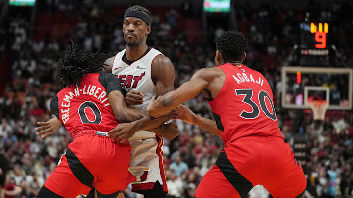 Miami Heat forward Jimmy Butler (22) collides with Toronto Raptors guard Javon Freeman-Liberty (0) during the first half at Kaseya Center. Mandatory Credit: Jim Rassol-Imagn Images Miami Heat forward Jimmy Butler (22) collides with Toronto Raptors guard Javon Freeman-Liberty (0) during the first half at Kaseya Center. Mandatory Credit: Jim Rassol-Imagn Images