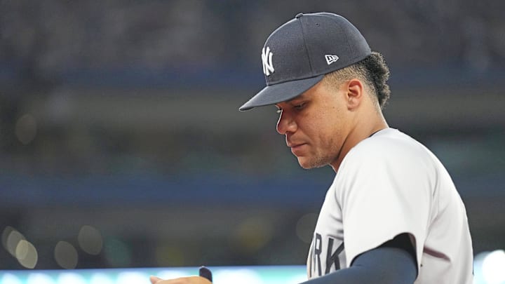 New York Yankees right fielder Juan Soto (22) walks towards the dugout against the Toronto Blue Jays at the end of the seventh inning at Rogers Centre in 2024.