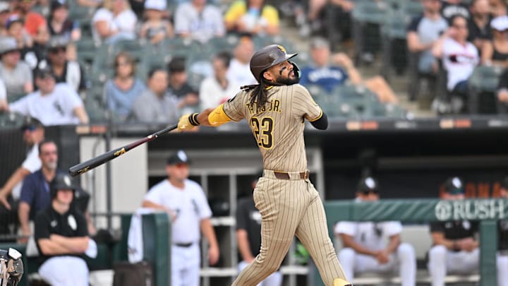 Sep 21, 2025; Chicago, Illinois, USA; San Diego Padres right fielder Fernando Tatis Jr. (23) hits a single against the Chicago White Sox during the seventh inning at Rate Field. Mandatory Credit: Patrick Gorski-Imagn Images