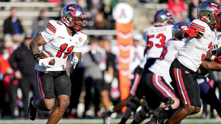 Dec 18, 2023; Charlotte, NC, USA; Western Kentucky Hilltoppers wide receiver Malachi Corley (11) runs the ball against the Old Dominion Monarchs during the first quarter at Charlotte 49ers' Jerry Richardson Stadium. 