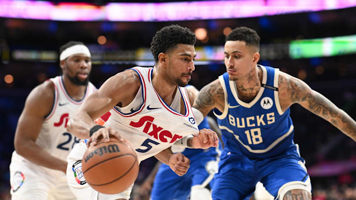 Apr 3, 2025; Philadelphia, Pennsylvania, USA; Philadelphia 76ers guard Quentin Grimes (5) drives against Milwaukee Bucks forward Kyle Kuzma (18) in the fourth quarter at Wells Fargo Center. Mandatory Credit: Kyle Ross-Imagn Images