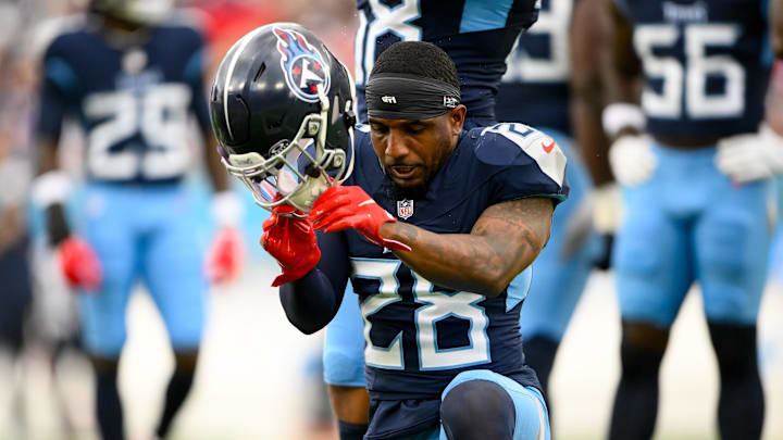 Tennessee Titans safety Quandre Diggs slams his helmet down after an ankle injury against the New England Patriots. Mandatory Credit: Steve Roberts-Imagn Images