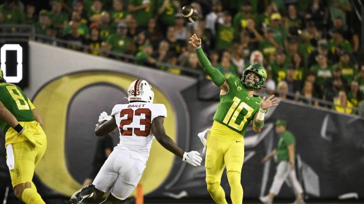 Oct 1, 2022; Eugene, Oregon, USA; Oregon Ducks quarterback Bo Nix (10) throws a pass during the first half against Stanford Cardinal defensive end David Bailey (23) at Autzen Stadium. Mandatory Credit: Troy Wayrynen-USA TODAY Sports Oct 1, 2022; Eugene, Oregon, USA; Oregon Ducks quarterback Bo Nix (10) throws a pass during the first half against Stanford Cardinal defensive end David Bailey (23) at Autzen Stadium. Mandatory Credit: Troy Wayrynen-USA TODAY Sports