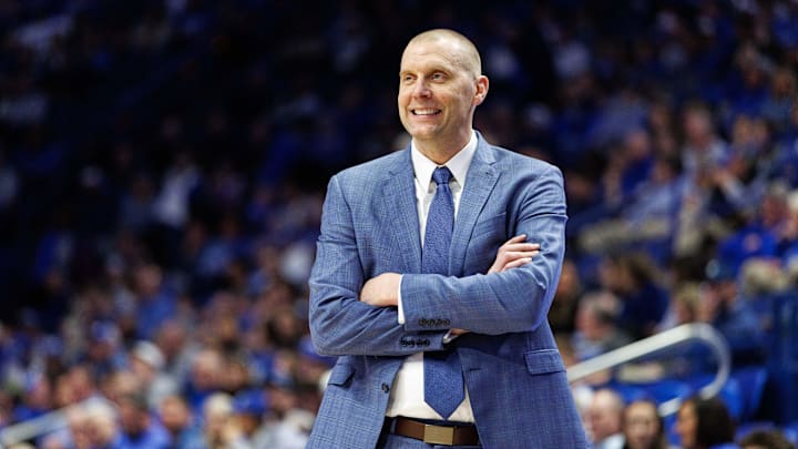 Feb 8, 2025; Lexington, Kentucky, USA; Kentucky Wildcats head coach Mark Pope smiles as he watches the action during the second half against the South Carolina Gamecocks at Rupp Arena at Central Bank Center. Mandatory Credit: Jordan Prather-Imagn Images