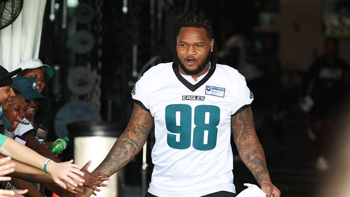 Jul 29, 2026; Philadelphia, PA, USA; Philadelphia Eagles defensive tackle Jalen Carter (98) greets fans as he takes the field for training camp at Jefferson Health Training Complex. Jul 29, 2026; Philadelphia, PA, USA; Philadelphia Eagles defensive tackle Jalen Carter (98) greets fans as he takes the field for training camp at Jefferson Health Training Complex.