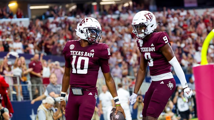 Sep 28, 2024; Arlington, Texas, USA; Texas A&M Aggies quarterback Marcel Reed (10) celebrates with Texas A&M Aggies wide receiver Jahdae Walker (9) after scoring a touchdown during the first half against the Arkansas Razorbacks at AT&T Stadium. Mandatory Credit: Kevin Jairaj-Imagn Images