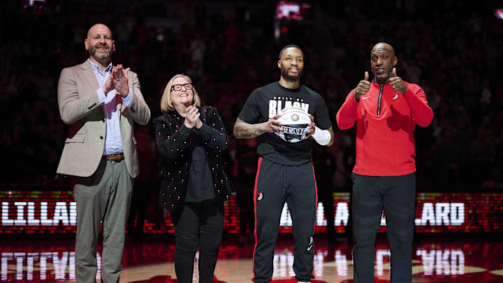 Feb 14, 2023; Portland, Oregon, USA; Portland Trail Blazers GM Joe Cronin, left, owner Jody Allen, and head coach Chauncey Billups stand with guard Damian Lillard (0) as he is congratulated on making the NBA All Star team before a game against the Washington Wizards at Moda Center. Mandatory Credit: Troy Wayrynen-Imagn Images