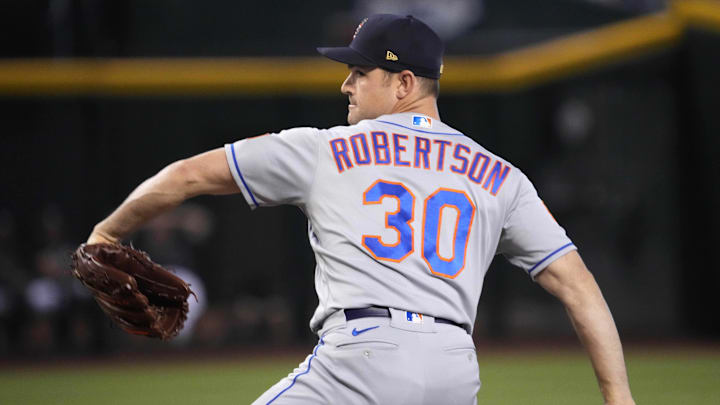 Jul 4, 2023; Phoenix, Arizona, USA; New York Mets relief pitcher David Robertson (30) pitches against the Arizona Diamondbacks during the ninth inning at Chase Field. Mandatory Credit: Joe Camporeale-Imagn Images