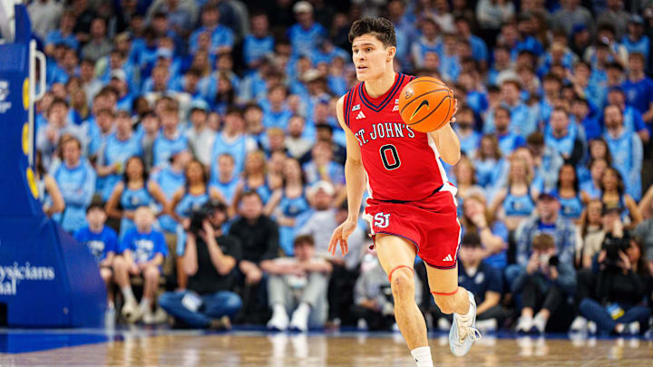 Jan 10, 2026; Omaha, Nebraska, USA; St. John's basketball guard Dylan Darling (0) dribbles during the first half against the Creighton Bluejays at CHI Health Center Omaha.