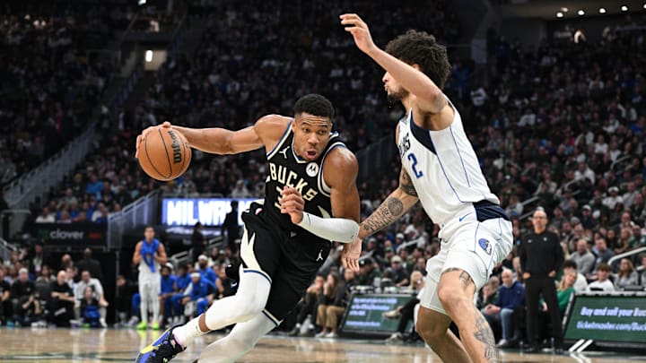 Nov 18, 2023; Milwaukee, Wisconsin, USA: Milwaukee Bucks forward Giannis Antetokounmpo (34) drives to the basket against Dallas Mavericks center Dereck Lively II (2) in the first half at Fiserv Forum. Mandatory Credit: Michael McLoone-Imagn Images