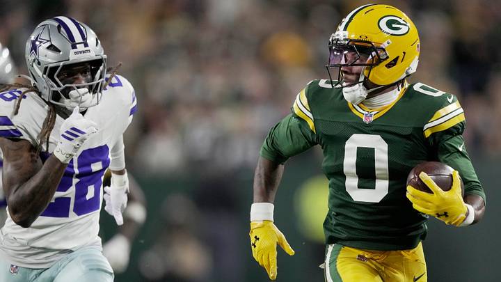 Green Bay Packers wide receiver Matthew Golden (0) is pursued by Dallas Cowboys' Shavon Revel Jr. (28) 