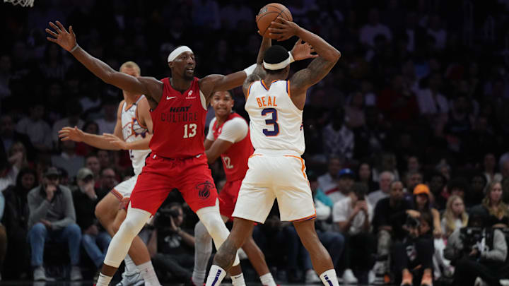 Dec 7, 2024; Miami, Florida, USA;  Miami Heat center Bam Adebayo (13) pressures Phoenix Suns guard Bradley Beal (3) during the second half at Kaseya Center. Mandatory Credit: Jim Rassol-Imagn Images