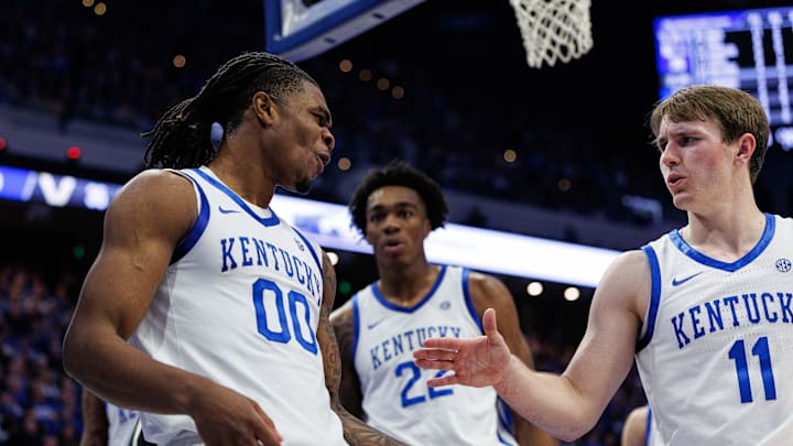 Feb 19, 2025; Lexington, Kentucky, USA; Kentucky Wildcats guard Otega Oweh (00) celebrates with guard Travis Perry (11) after blocking a shot by the Vanderbilt Commodores during the first half at Rupp Arena at Central Bank Center. Mandatory Credit: Jordan Prather-Imagn Images