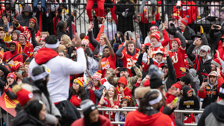 Feb 15, 2023; Kansas City, MO, USA; Kansas City Chiefs fans cheer as players go by at the Super Bowl LVII Champions Parade in downtown Kansas City, Mo. Mandatory Credit: Amy Kontras-Imagn Images