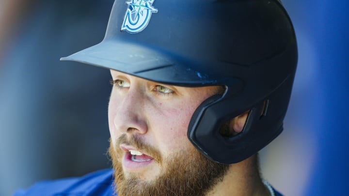 Seattle Mariners first baseman Tyler Locklear (27) reacts after scoring a run during the seventh inning against the Kansas City Royals at Kauffman Stadium on June 9.