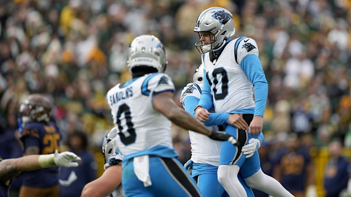 Nov 2, 2025; Green Bay, Wisconsin, USA; Carolina Panthers place kicker Ryan Fitzgerald (10) celebrates with punter Sam Martin (6) after kicking a game-winning field goal during the fourth quarter against the Green Bay Packers at Lambeau Field. Mandatory Credit: Jeff Hanisch-Imagn Images