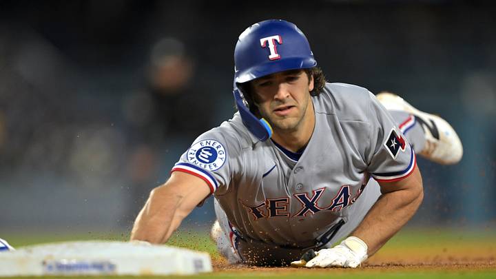 Apr 10, 2026; Los Angeles, California, USA;  Texas Rangers shortstop Josh Smith (8) dives back to first base on a pick off attempt by the Los Angeles Dodgers during the third inning at Dodger Stadium. Mandatory Credit: Jayne Kamin-Oncea-Imagn Images