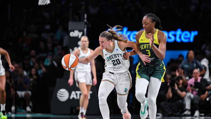 Jul 6, 2025; Brooklyn, New York, USA; New York Liberty guard Sabrina Ionescu (20) brings the ball up court while being defended by Seattle Storm forward Nneka Ogwumike (3) during the second half at Barclays Center. Jul 6, 2025; Brooklyn, New York, USA; New York Liberty guard Sabrina Ionescu (20) brings the ball up court while being defended by Seattle Storm forward Nneka Ogwumike (3) during the second half at Barclays Center.