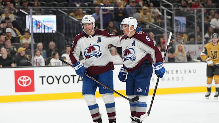 Oct 9, 2024; Las Vegas, Nevada, USA; Colorado Avalanche right wing Mikko Rantanen (96) celebrates with defenseman Cale Makar (8) after scoring a goal against the Vegas Golden Knights during the third period at T-Mobile Arena. Mandatory Credit: Lucas Peltier-Imagn Images