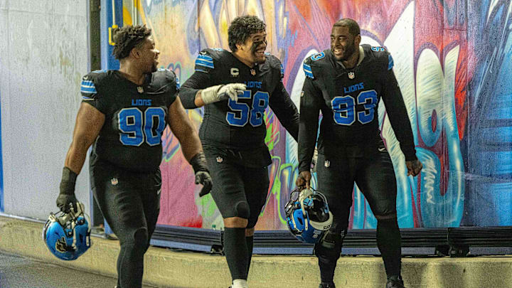 Detroit Lions defensive tackle Chris Smith (90), offensive tackle Penei Sewell (58) and defensive end Josh Paschal (93).