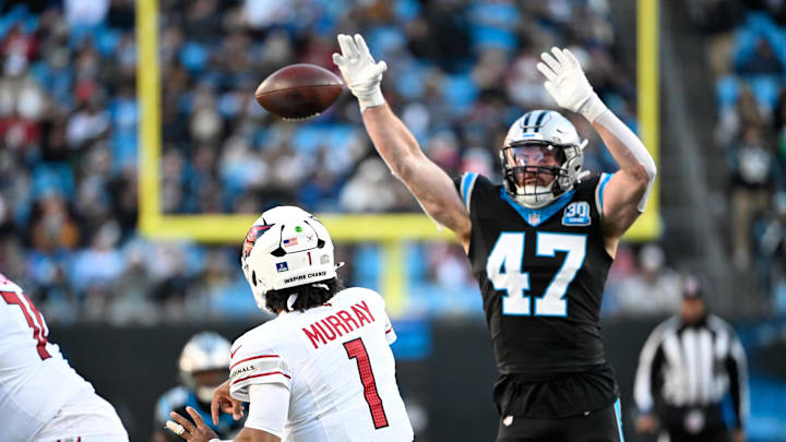 Dec 22, 2024; Charlotte, North Carolina, USA; Arizona Cardinals quarterback Kyler Murray (1) passes the ball as Carolina Panthers linebacker Josey Jewell (47) pressures in the third quarter at Bank of America Stadium. Mandatory Credit: Bob Donnan-Imagn Images