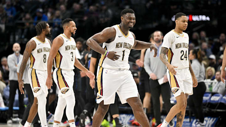 New Orleans Pelicans forward Naji Marshall (8) and guard CJ McCollum (3) and forward Zion Williamson (1) and guard Jordan Hawkins (24) celebrate during the game between the Dallas Mavericks and the New Orleans Pelicans at the American Airlines Center. Mandatory Credit: Jerome Miron-Imagn Images