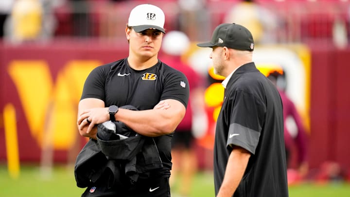 Cincinnati Bengals defensive end Trey Hendrickson (91) talks with director of player personnel Duke Tobin before the first quarter of the NFL Preseason Week 2 game between the Washington Commanders and the Cincinnati Bengals at Northwest Stadium in Landover, Md., on Monday, Aug. 18, 2025.